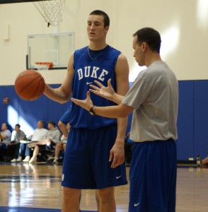 Duke Assistant Coach Chris Collins instructs freshman Mile Plumlee in practice.