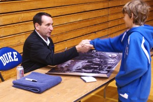 Coach K shakes the hand of an adoring fan during a recent event - BDN Photo