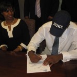 Tyler Thornton puts pen to paper to officially become a future Blue Devil - Photo courtesy of Real Thornton pictured left.