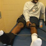 West Virginia's Darryl Bryant gets treatment on Friday. The burning question is will he play in the Duke game.