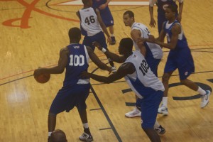 Tyler Adams pushes Joseph Uchebo off the blocks during afternoon action at the NBAPA Top 100 Camp in Charlottesville (join BDN Premium for full site access and updates) - BDN Photo