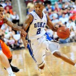 Smith drives the ball against Virginia Tech, Rick Crank photo for BDN