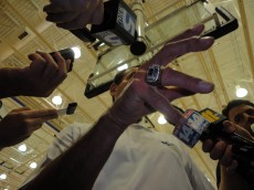 Coach K's championship ring stands out as he is swamed by the media during the opening day of the annual Coach K Academy in Durham, N.C. = BDN Photo.  